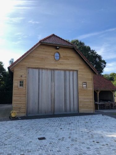 Garagepoort in eik, onbehandeld, groot en zwaar model